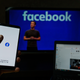 Facebook on laptop and phone, Mark Zuckerberg in background